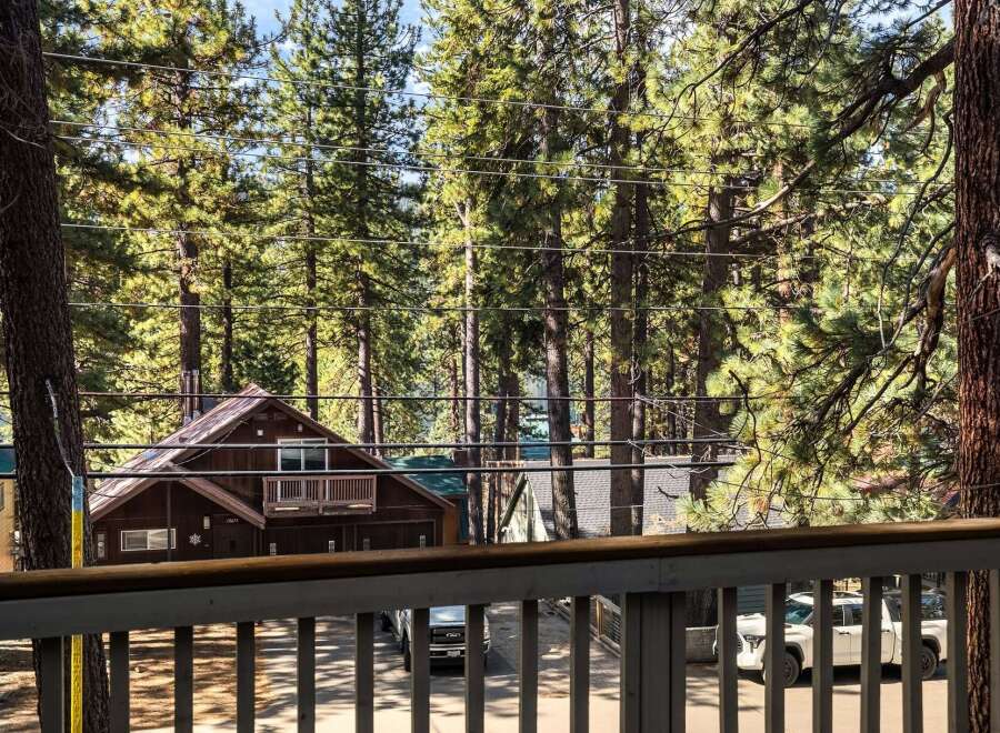 Nestled amidst towering trees, this charming property offers a serene escape.