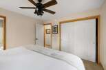 Discover the charm of this inviting bedroom, featuring a cozy bed and ample natural light.