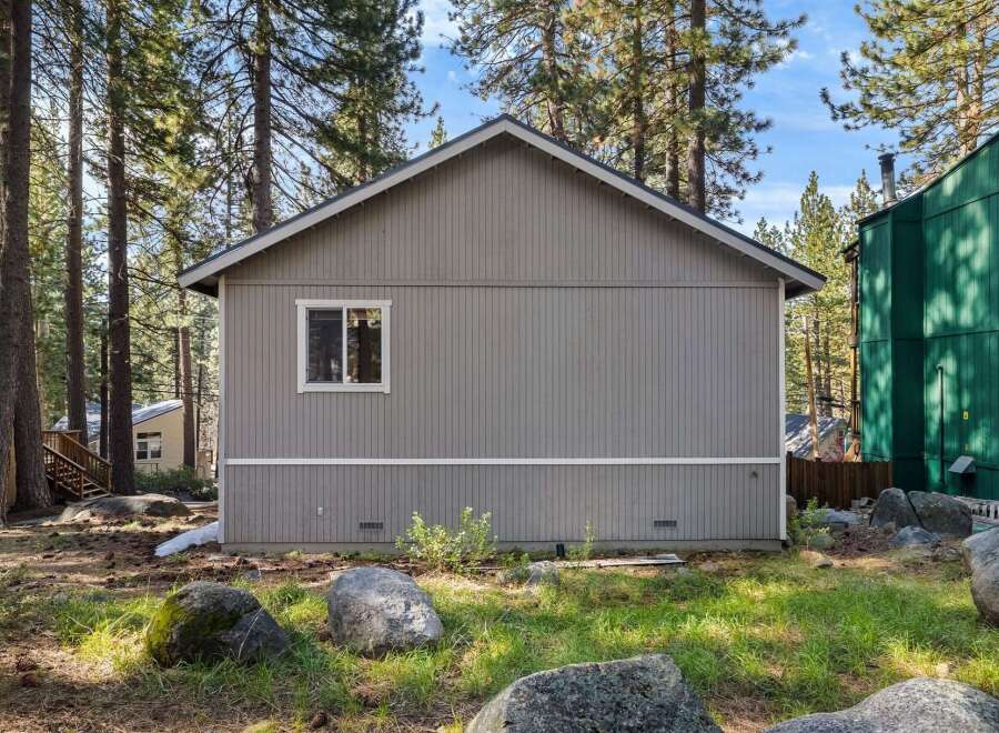 Nestled in a serene, wooded setting, this charming property offers a tranquil escape.