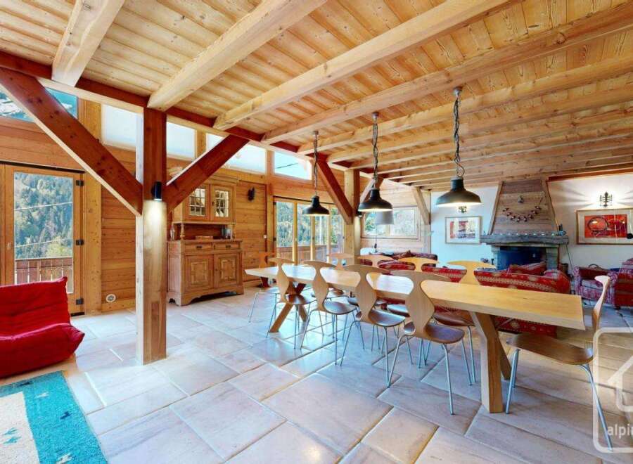 Experience the charm of this stunning property, featuring a beautifully designed interior with exposed wooden beams and a cozy fireplace.