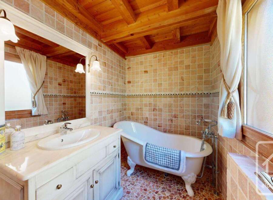 Step into a charming bathroom with a clawfoot tub, perfect for a relaxing soak.