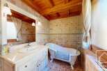 Step into a charming bathroom with a clawfoot tub, perfect for a relaxing soak.