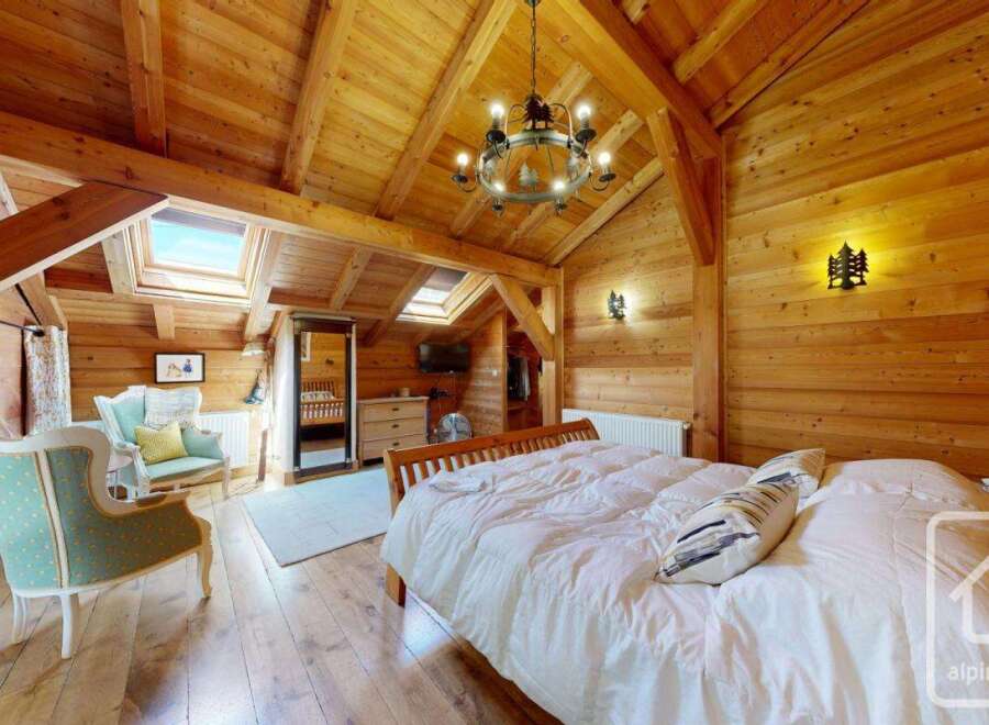 Experience the charm of this stunning wooden-clad bedroom, a perfect blend of rustic elegance and modern comfort.