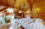Experience the charm of this stunning wooden-clad bedroom, a perfect blend of rustic elegance and modern comfort.