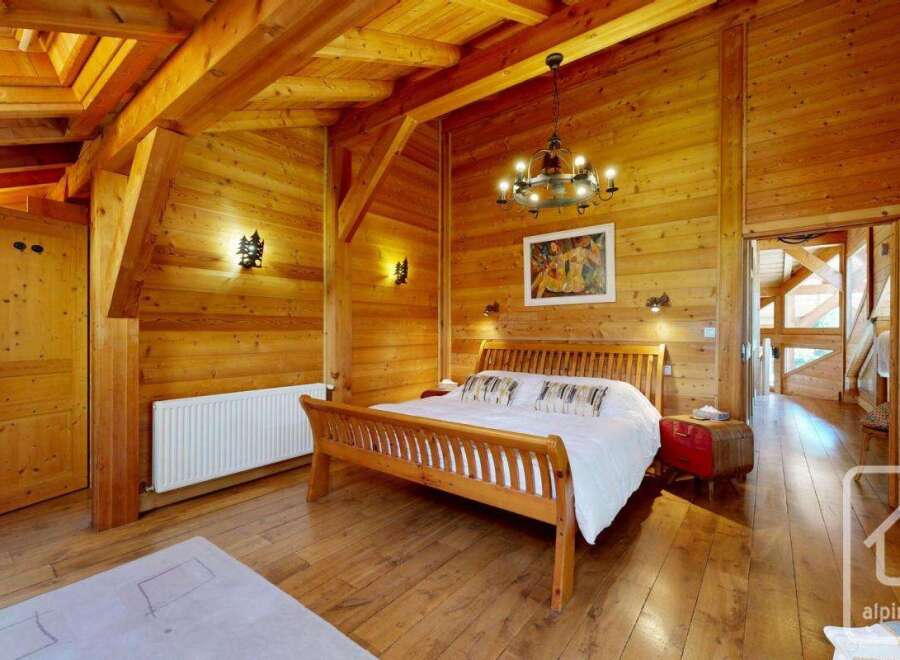 Step into rustic elegance with this stunning bedroom featuring warm wooden accents throughout.