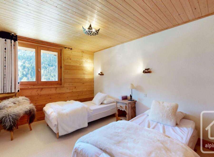Discover the charm of this cozy bedroom, perfect for a relaxing getaway.