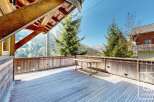Enjoy breathtaking mountain views from this stunning wooden deck.