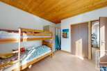 Discover this charming property featuring a cozy bunk bed setup, perfect for accommodating guests or family.