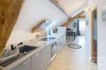 This charming property boasts a modern kitchen with sleek cabinetry and integrated appliances, perfect for culinary enthusiasts.