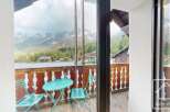 Enjoy breathtaking mountain views from this charming balcony.