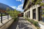 Discover the charm of this stunning property, showcasing a beautiful facade adorned with lush greenery.