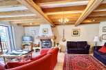 This charming living room boasts a cozy fireplace, perfect for those chilly evenings.