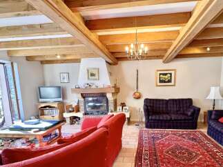 This charming living room boasts a cozy fireplace, perfect for those chilly evenings.