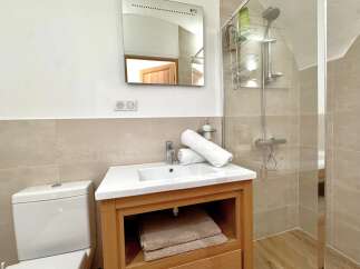 Step into this beautifully designed bathroom, featuring a modern vanity with ample storage and a pristine white sink.