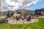 Enjoy the ultimate outdoor living experience with this stunning property! Featuring a cozy fire pit surrounded by comfortable seating, perfect for entertaining or relaxing.