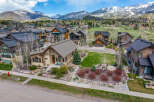 Nestled in a picturesque mountain setting, this stunning property boasts exquisite architectural details and a warm, inviting ambiance.
