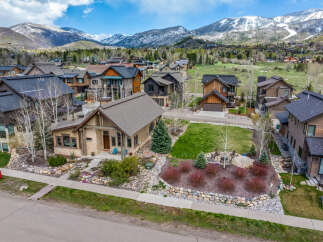 Nestled in a picturesque mountain setting, this stunning property boasts exquisite architectural details and a warm, inviting ambiance.