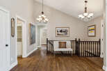 This stunning property boasts a beautifully designed interior with hardwood floors and elegant light fixtures.