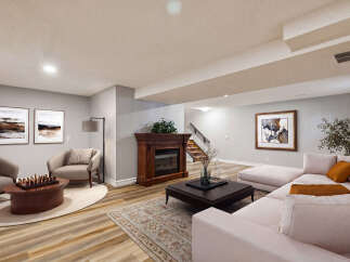 Step into luxury with this stunning living space, featuring a cozy fireplace and elegant artwork.