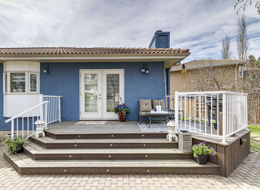 Enjoy outdoor living at its finest with this stunning property featuring a spacious deck and inviting patio.