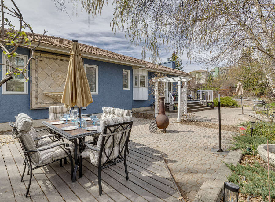 Enjoy outdoor living at its finest in this stunning property! This home features a beautifully designed patio with a dining set, perfect for entertaining or relaxing.