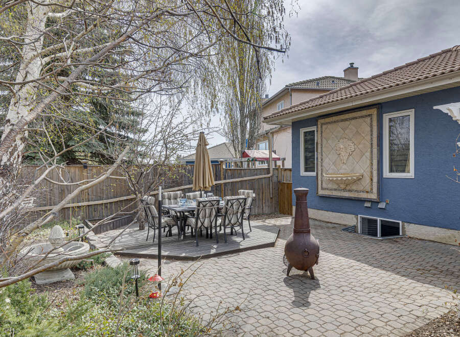 Enjoy outdoor living in this stunning backyard oasis! This property features a beautiful patio area, perfect for entertaining or relaxing.