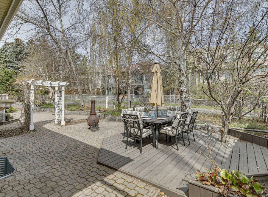 Enjoy outdoor living at its finest with this stunning property featuring a beautifully designed patio and deck.