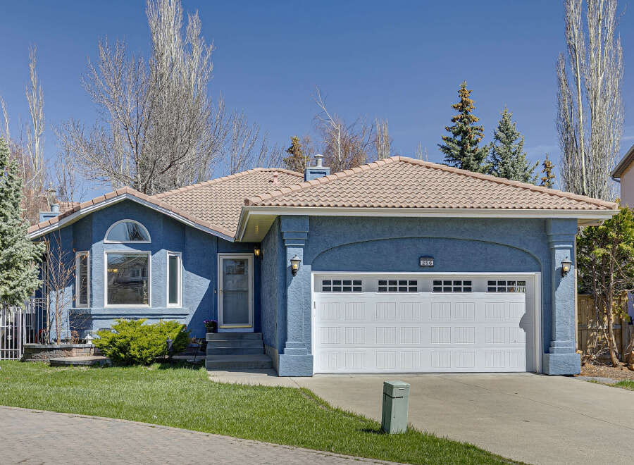 This stunning property boasts a beautiful blue exterior and a charming curb appeal.