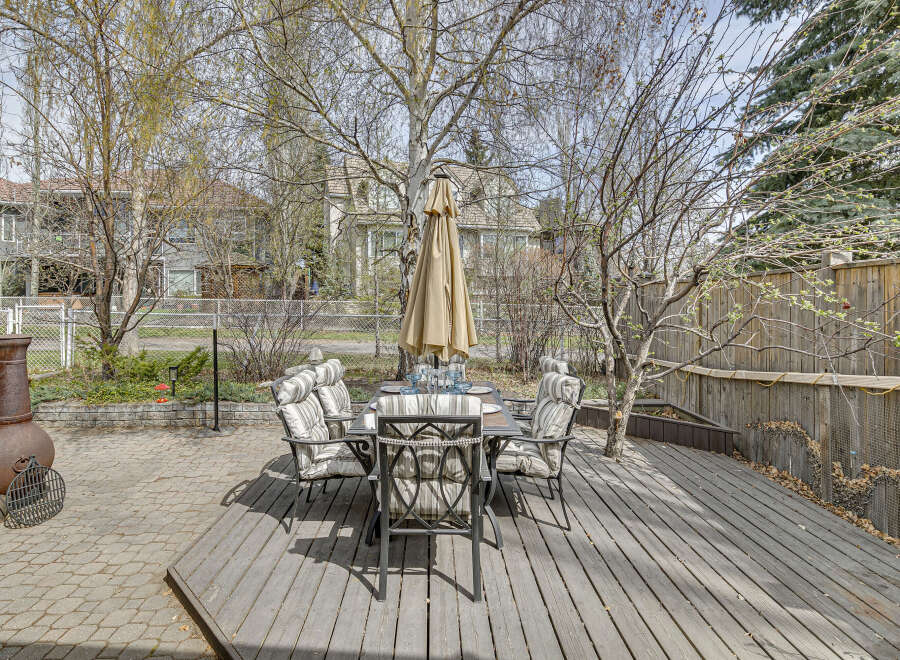 Enjoy outdoor dining and relaxation in this beautiful backyard oasis.