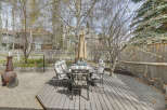 Enjoy outdoor dining and relaxation in this beautiful backyard oasis.