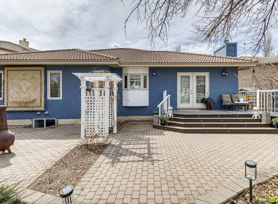Discover the charm of this stunning property, showcasing a beautifully designed backyard.