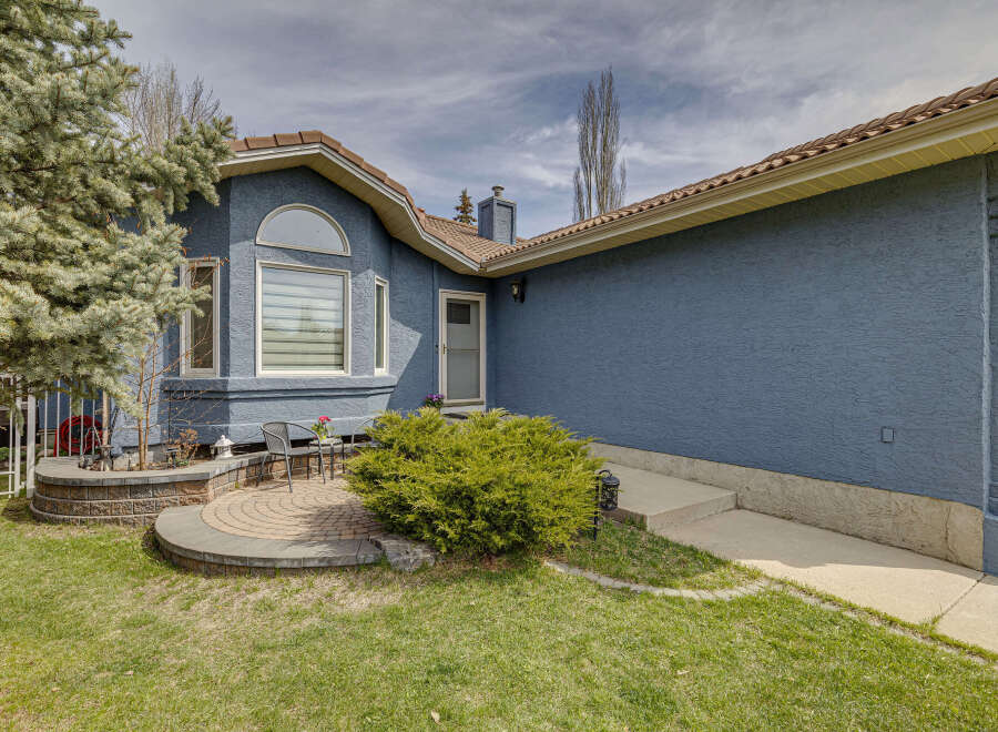This stunning property boasts a beautifully landscaped front yard, perfect for curb appeal.