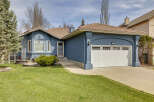 Discover this stunning property featuring a beautifully designed exterior with a charming blue facade and a welcoming front yard.
