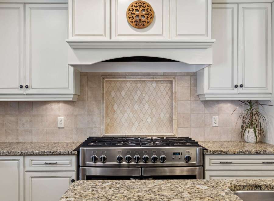 This stunning kitchen boasts a modern design with high-end appliances and elegant finishes.