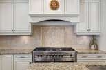 This stunning kitchen boasts a modern design with high-end appliances and elegant finishes.