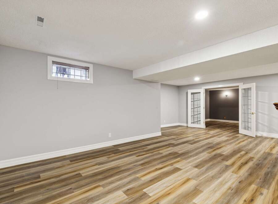 Step into this inviting space with beautiful wood flooring and a neutral color palette, perfect for any design style.