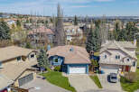 Discover this stunning property featuring a beautiful blue exterior and a well-maintained lawn.
