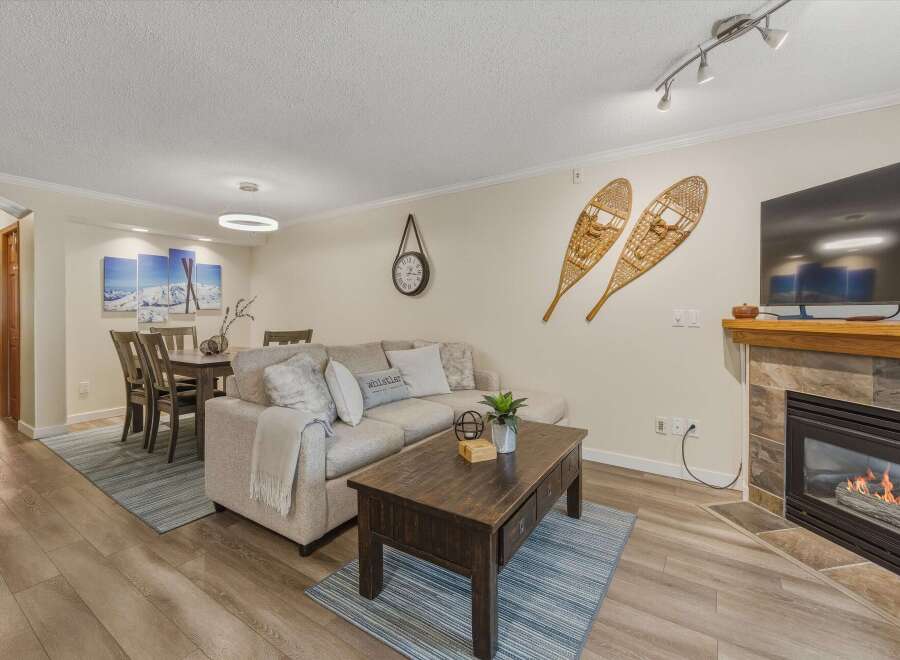 This cozy living space features a comfortable sectional sofa, perfect for relaxing after a long day.