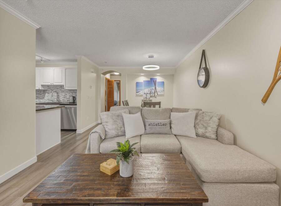 This stunning property boasts a spacious living area, perfect for relaxation and entertaining.