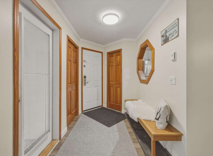 Step into this inviting entryway, showcasing a blend of warmth and style.