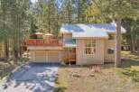 Nestled amidst towering trees, this stunning property offers a tranquil retreat.