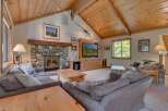 This stunning living room boasts a cozy stone fireplace, perfect for chilly evenings.