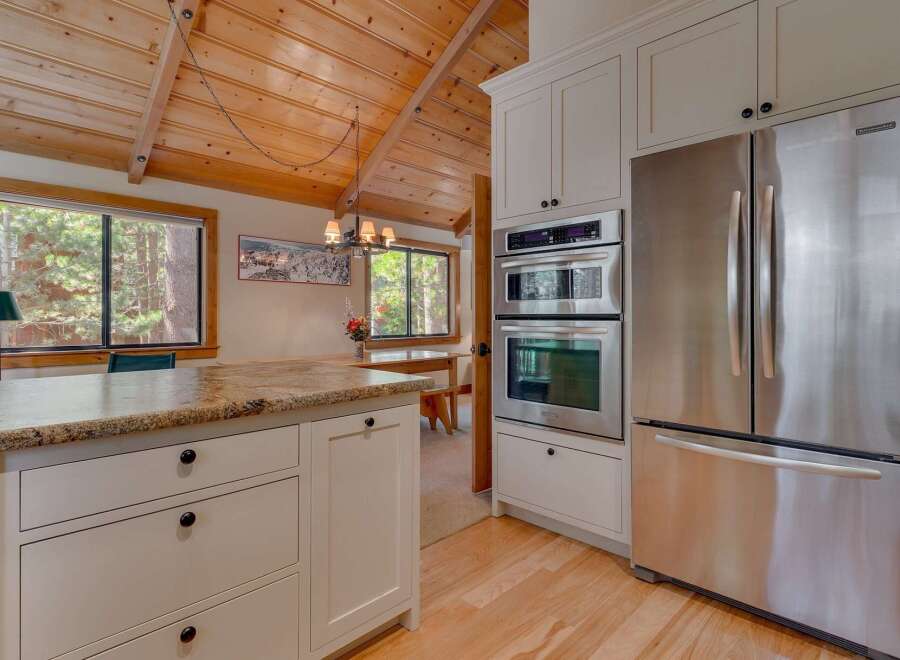 This stunning kitchen boasts a modern design with stainless steel appliances and custom cabinetry.