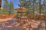 Enjoy outdoor living at its finest on this expansive wooden deck.