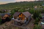 Discover your dream retreat in this stunning mountain home! This property boasts a spacious deck with a hot tub, perfect for enjoying breathtaking views.