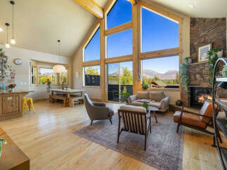 Experience luxury living in this stunning property, featuring a spacious open floor plan and breathtaking mountain views.