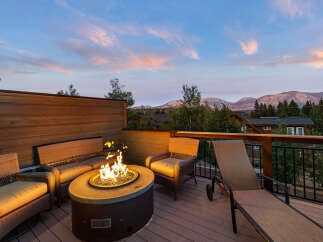 Enjoy breathtaking mountain views from this stunning outdoor living space.