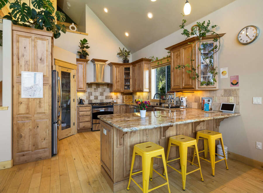 Step into this stunning kitchen, a perfect blend of rustic charm and modern design.