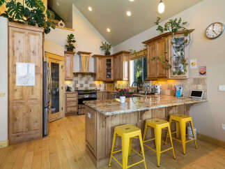 Step into this stunning kitchen, a perfect blend of rustic charm and modern design.