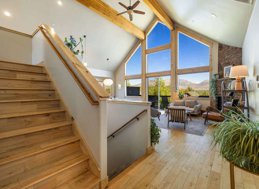 This stunning property boasts a grand staircase leading to a bright and airy living space.